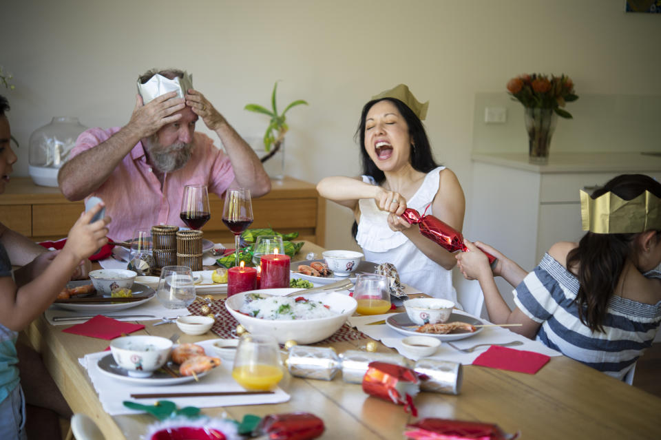 Family enjoying traditional summery Christmas Lunch.