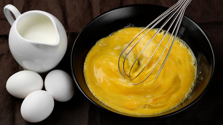 eggs and milk bowl with whisk