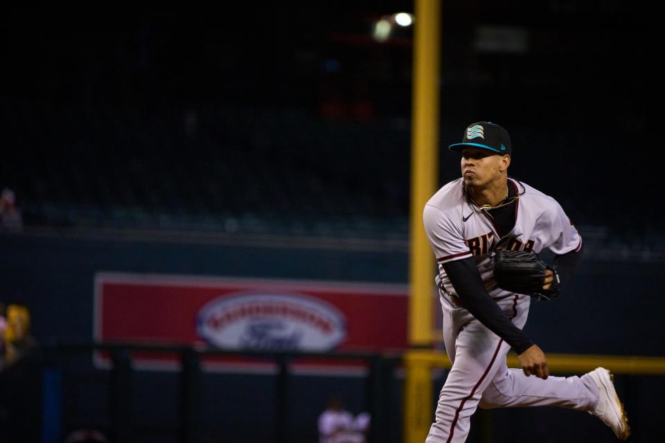 Oct 15, 2022; Phoenix, AZ, USA; Salt River Rafters pitcher Justin Martinez (33) pitches against the Surprise Saguaros at Chase Field.