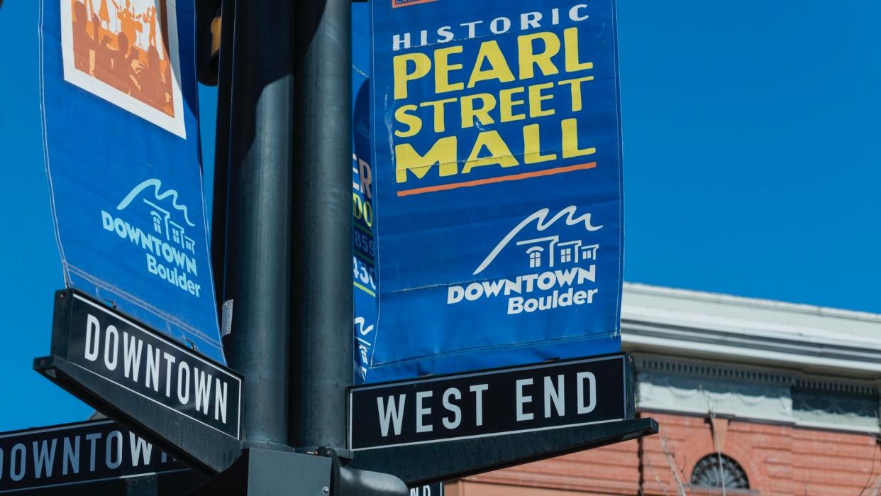 Boulder, Colorado, USA - March 10, 2013: Signs for the Historic Pearl Street Mall, a pedestrian zone full of shops and restaurants and a popular tourist attraction.