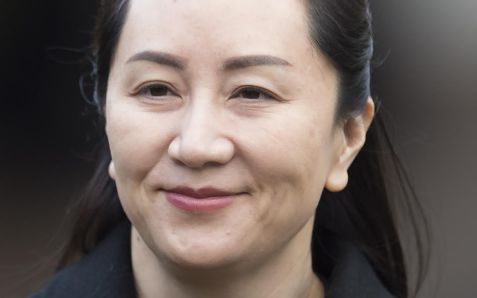 Meng Wanzhou, chief financial officer of Huawei, leaves her home to go to B.C. Supreme Court in Vancouver, Tuesday, Jan. 21, 2020. Wanzhou is in court for hearings over an American request to extradite the executive of the Chinese telecom giant Huawei on fraud charges. (Jonathan Hayward/The Canadian Press via AP)