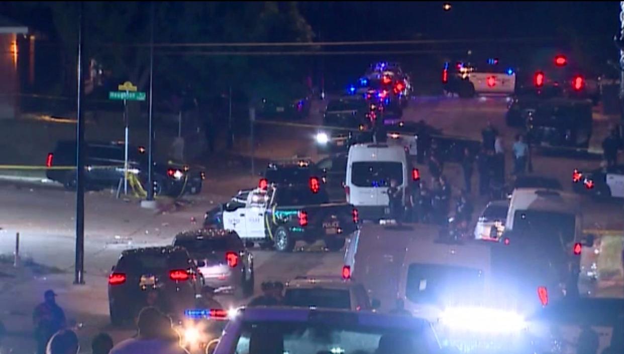 Police arrive on the scene of a deadly shooting late Monday, July 3, 2023 in Forth Worth, Texas. Authorities say gunfire erupted following a local festival in the Como neighborhood in the city's southwest. (WFAA via AP) ((WFAA via AP))