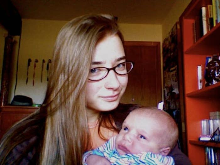 The author, 19 years old, holding baby No. 16, Elijah, in Monument, Colorado, in 2011