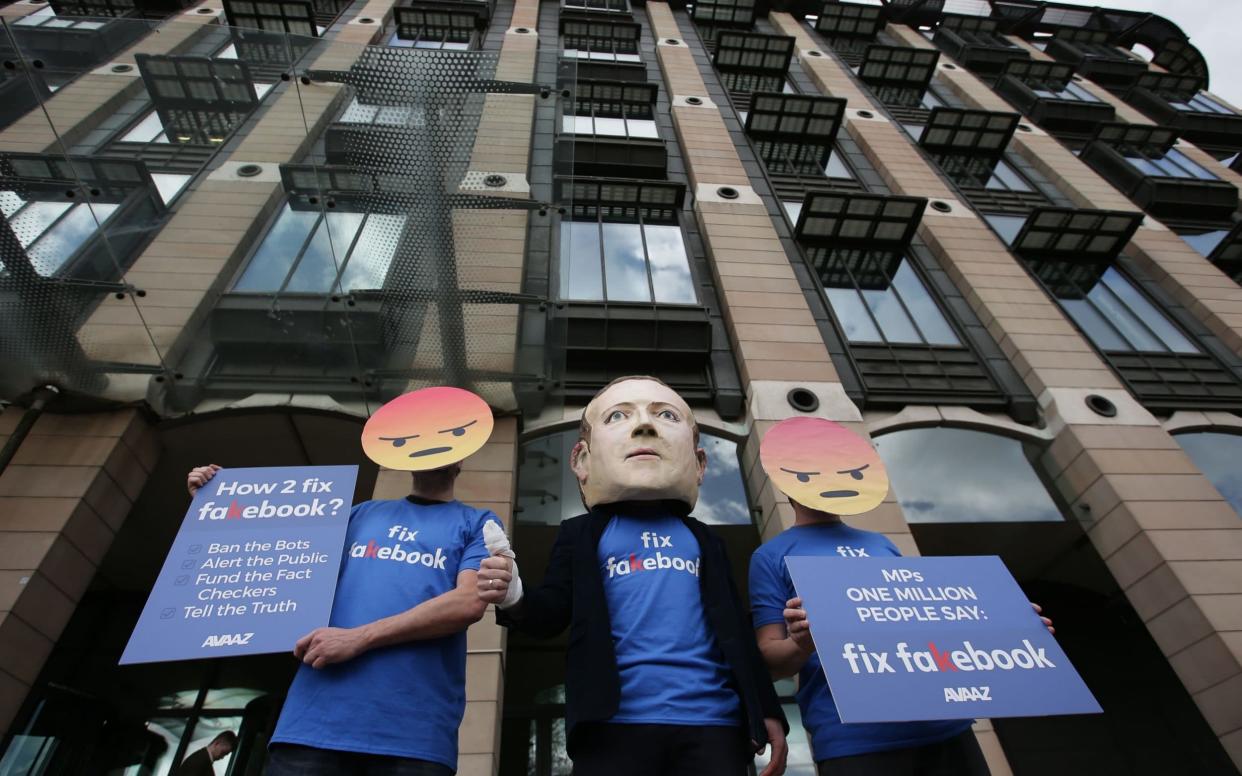 Anti-Facebook demonstrators outside Portcullis House in April 2018 - AFP