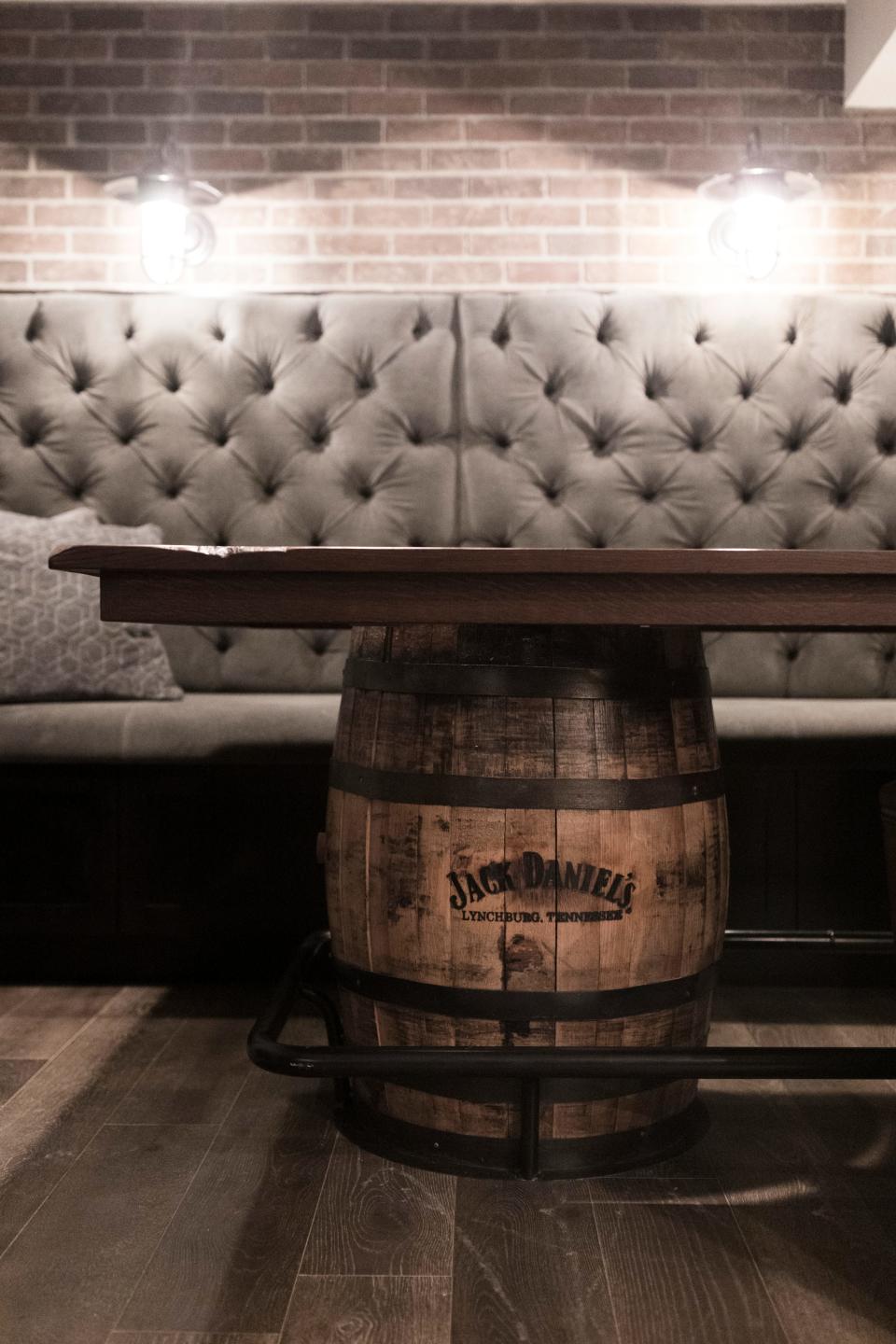 A Prohibition-inspired whiskey barrel was used in a basement speak-easy remodel in Hudson, Ohio.