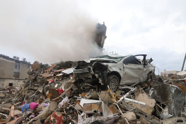 A damaged vehicle is seen on top the rubbles after an earthquake in Iskenderun, Turkey.