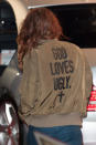 With her back to the cameras, Stewart's jacket reads "God Loves Ugly." Picture by: Reimschuessel / Splash News