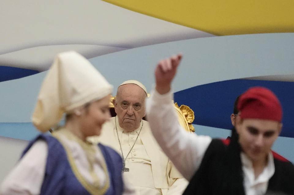 Pope Francis meets young people at the Saint Dionysius School of the Ursuline Sisters in Athens, Greece, Monday, Dec. 6, 2021. Francis' five-day trip to Cyprus and Greece has been dominated by the migrant issue and Francis' call for European countries to stop building walls, stoking fears and shutting out "those in greater need who knock at our door." (AP Photo/Alessandra Tarantino)