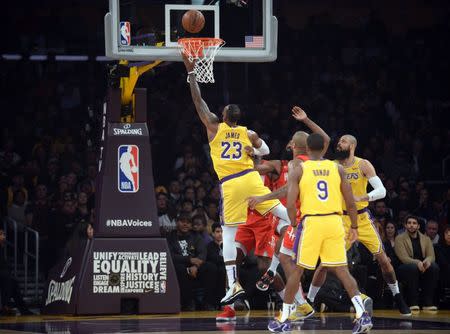 February 21, 2019; Los Angeles, CA, USA; Los Angeles Lakers forward LeBron James (23) shoots to score a basket against the Houston Rockets during the first half at Staples Center. Mandatory Credit: Gary A. Vasquez-USA TODAY Sports