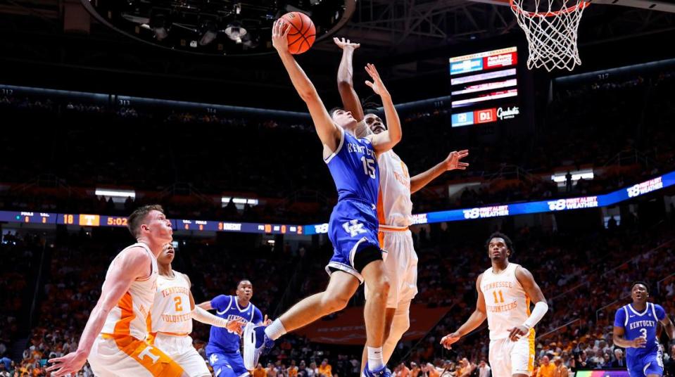 Kentucky guard Reed Sheppard (15) drives to the basket against Tennessee forward Jonas Aidoo (0) during Saturday’s game at Thompson-Boling Arena in Knoxville.