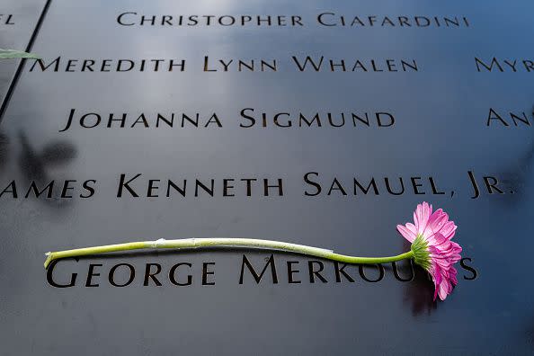 NEW YORK, NEW YORK - SEPTEMBER 11: A flower is left on a name at the 9/11 Memorial at the Ground Zero site in lower Manhattan as the nation commemorates the 22nd anniversary of the attacks on September 11, 2023 in New York City. Monday marks the 22nd anniversary of the September 11 terrorist attacks on the World Trade Center and the Pentagon, as well as the crash of United Airlines Flight 93. In total, the attacks killed nearly 3,000 people and commenced a global war on terror which included American led conflicts in both Iraq and Afghanistan.   (Photo by Spencer Platt/Getty Images)