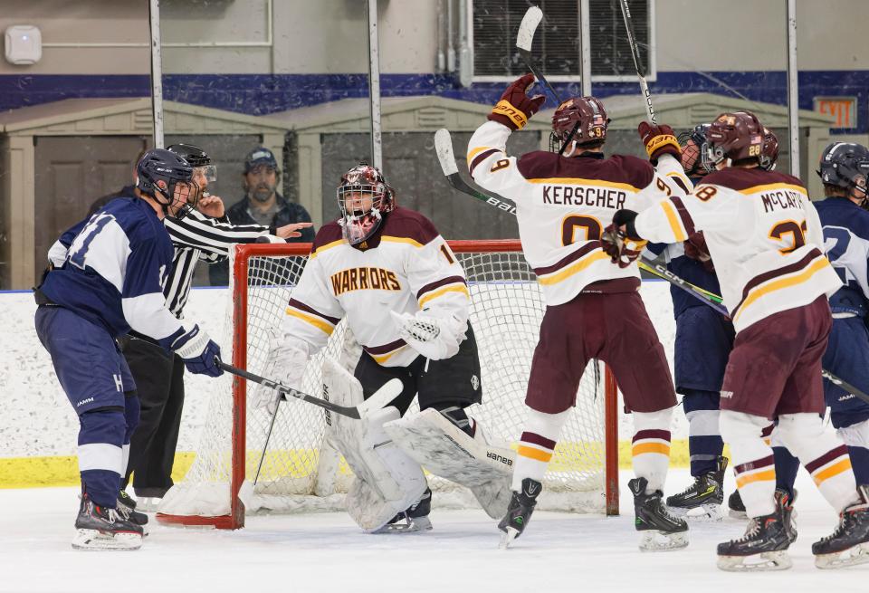 Walsh Jesuit players celebrate after defeating Hudson in a Division I district quarterfinal Wednesday at the Kent State Ice Arena.