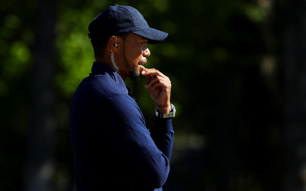 Vice-captain Tiger Woods of the United States looks on during morning foursome matches of the 2016 Ryder Cup at Hazeltine National Golf Club on October 1, 2016 in Chaska, Minnesota