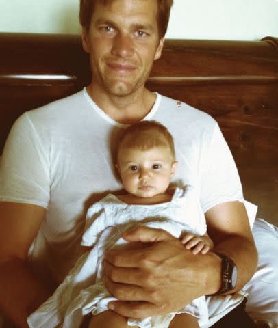 <p>Tom Brady Instagram</p> NFL star Tom Brady holds his youngest child Vivian Lake Brady as a baby.