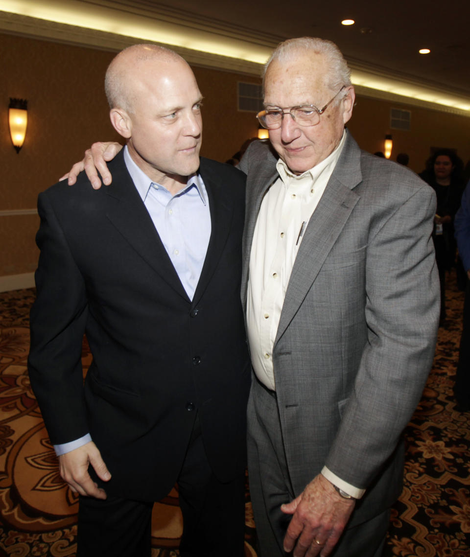 FILE - New Orleans Mayor Elect Lt. Gov. Mitch Landrieu, left, walks from a news conference with his father former New Orleans Mayor Moon Landrieu in New Orleans, Sunday, Feb. 7, 2010. Moon Landrieu, the patriarch of a Louisiana political family who was a lonely voice for civil rights until the tide turned in the 1960s, has died at age 92. A family friend said Landrieu died Monday, Sept. 5, 2022. (AP Photo/Bill Haber, File)