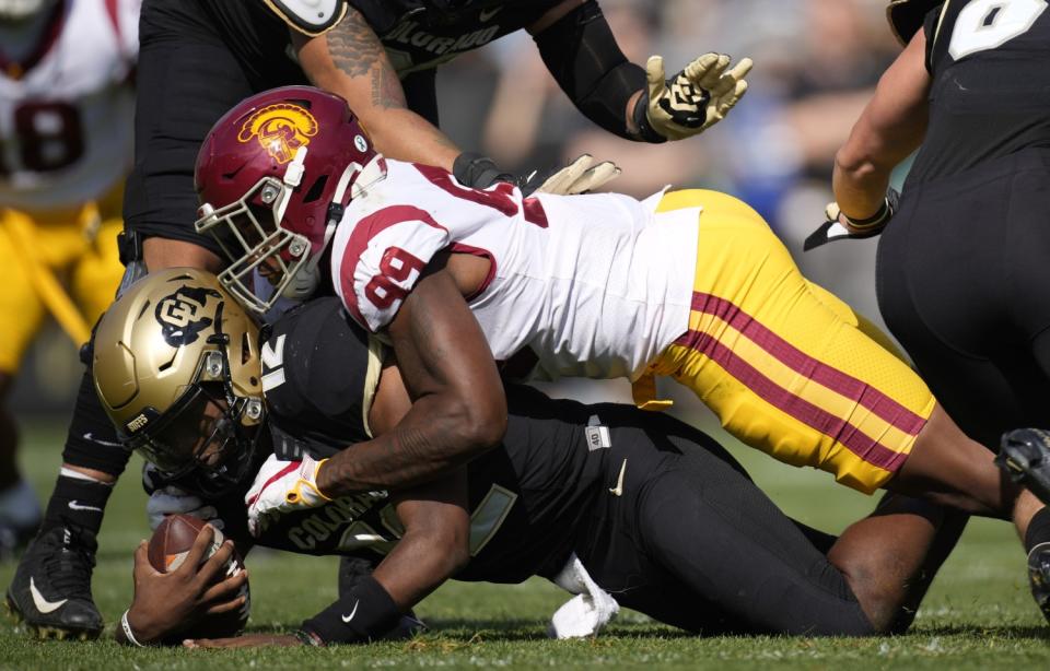 USC's Drake Jackson sacks Colorado's quarterback.