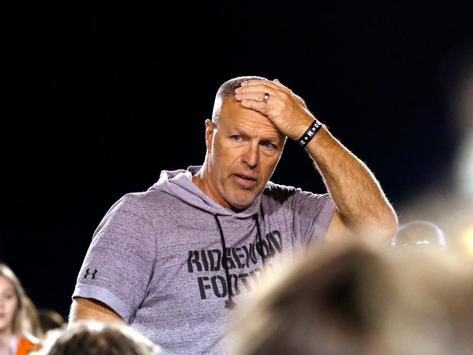 Ridgewood coach John Slusser talks to his team following a 42-14 win against Coshocton on Friday night at Stewart Field.