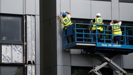 Cladding is removed from the side of Whitebean Court in Salford, Manchester, Britain June 26, 2017. REUTERS/Andrew Yates