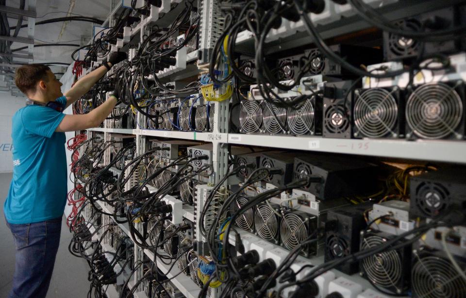 Banks of bitcoin mining computers in Russia. Photo: Olga Maltseva/AFP via Getty Images