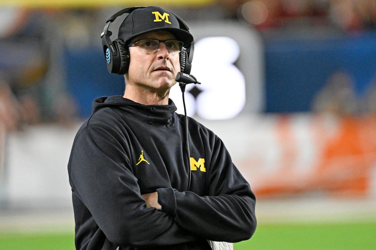 Michigan Wolverines head coach Jim Harbaugh watches from the sidelines during the College Football Playoff Semifinal game between the Georgia Bulldogs and the Michigan Wolverines at the Capital One Orange Bowl on December 31, 2021 at the Hard Rock Stadium in Miami Gardens, FL.