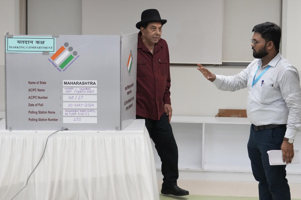 Indian actor Dharmendra walks after casting vote during the fifth round of multi-phase national elections in Mumbai, India, Monday, May 20, 2024. (AP Photo/Rafiq Maqbool)