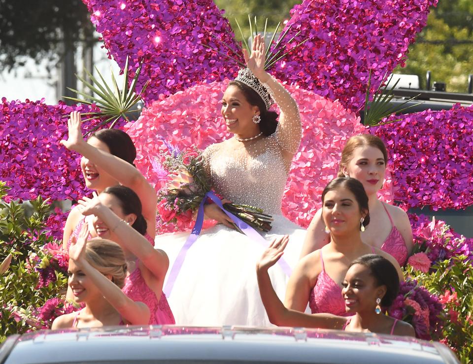 Azalea Queen Victoria Huggins waves to the crowds as hundreds of people came out Saturday, Aug. 21, 2021, to watch the Azalea Festival Parade come down 3rd street in downtown Wilmington.