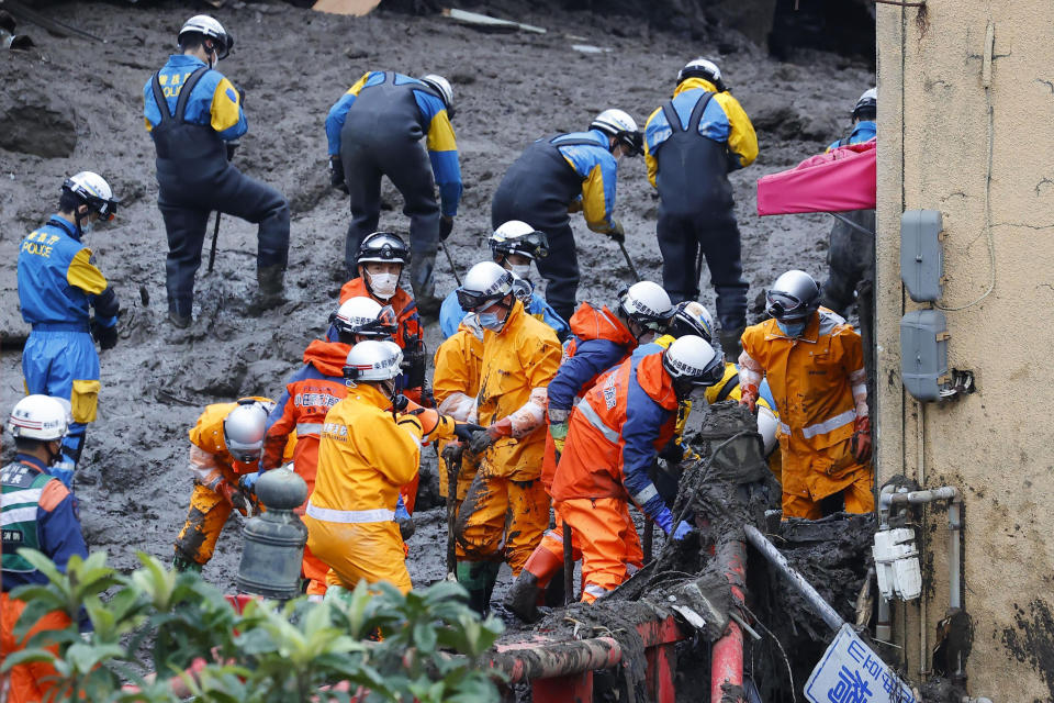 Rescuers continue a search operation at the site of a mudslide at Izusan in Atami, Shizuoka prefecture, southwest of Tokyo Monday, July 5, 2021.(Kyodo News via AP)