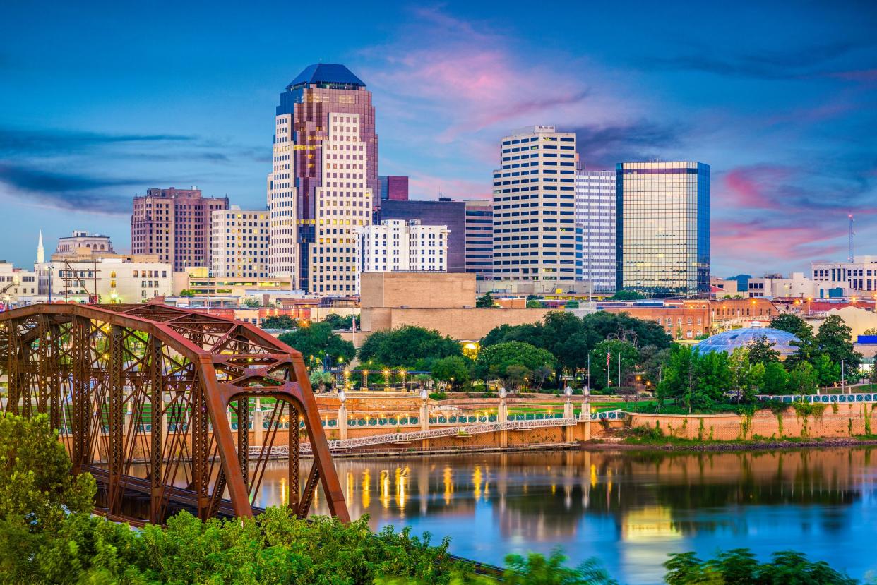 Shreveport, Louisiana, USA skyline over the Red River at dusk.