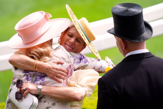 <p>David Davies/PA Images via Getty </p> Lady Gabriella and Zara Tindall hug at Royal Ascot on June 18, 2024