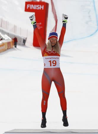 Alpine Skiing - Pyeongchang 2018 Winter Olympics - Women's Downhill - Jeongseon Alpine Centre - Pyeongchang, South Korea - February 21, 2018 - Silver medallist Ragnhild Mowinckel of Norway celebrates during the flower ceremony. REUTERS/Leonhard Foeger