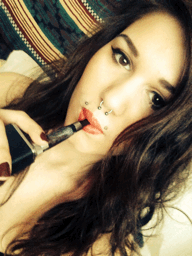 GIF of woman vaping