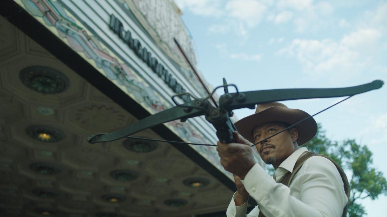 Hustle & 'Bow: Terrence Howard takes aim with a crossbow in "Showdown at the Grand."