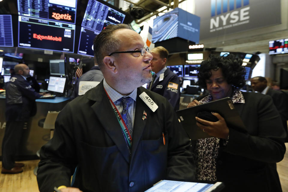 Trader Robert Arciero works on the floor of the New York Stock Exchange, Tuesday, Nov. 12, 2019. Stocks are opening slightly higher on Wall Street, led by gains in technology and health care companies. (AP Photo/Richard Drew)
