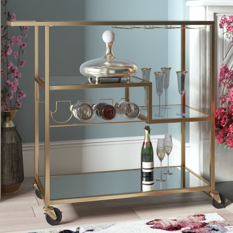 <p><a href="https://go.redirectingat.com?id=74968X1596630&url=https%3A%2F%2Fwww.wayfair.com%2F--%2Fpdp%2Fkelly-clarkson-home--miranda-bar-cart-x211184613-l6412-w005271181.html&sref=https%3A%2F%2F" rel="nofollow noopener" target="_blank" data-ylk="slk:Shop Now;elm:context_link;itc:0;sec:content-canvas" class="link ">Shop Now</a></p><p>Miranda Bar Cart</p><p>wayfair.com</p><p>$213.99</p><span class="copyright">Courtesy</span>