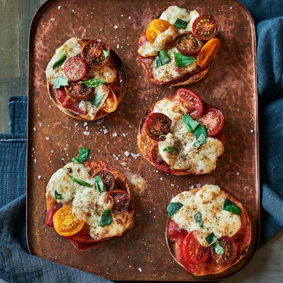 <p>Who needs pizza bagels when you have these? Just top English muffins with cheese, tomatoes and herbs for an easy snack. </p><p>Get the <a href="https://www.goodhousekeeping.com/food-recipes/a38983124/margherita-muffin-recipe/" rel="nofollow noopener" target="_blank" data-ylk="slk:Margherita Muffin recipe;elm:context_link;itc:0;sec:content-canvas" class="link "><strong>Margherita Muffin recipe</strong></a>. </p>