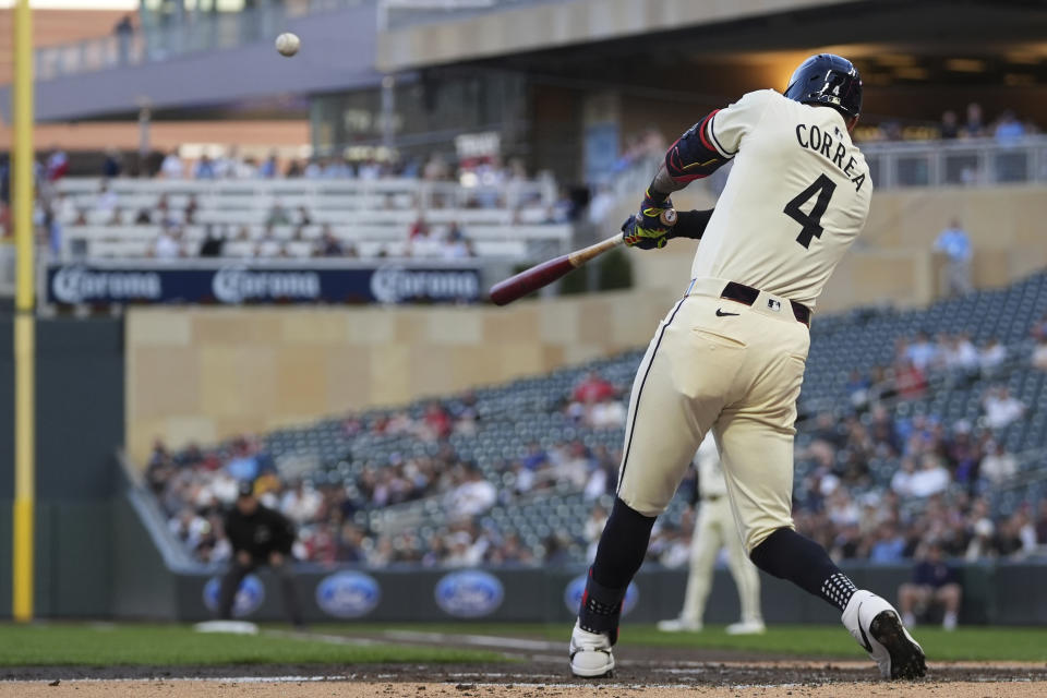 Minnesota Twins' Carlos Correa hits an RBI-double during the fifth inning of a baseball game against the Seattle Mariners, Monday, May 6, 2024, in Minneapolis. (AP Photo/Abbie Parr)