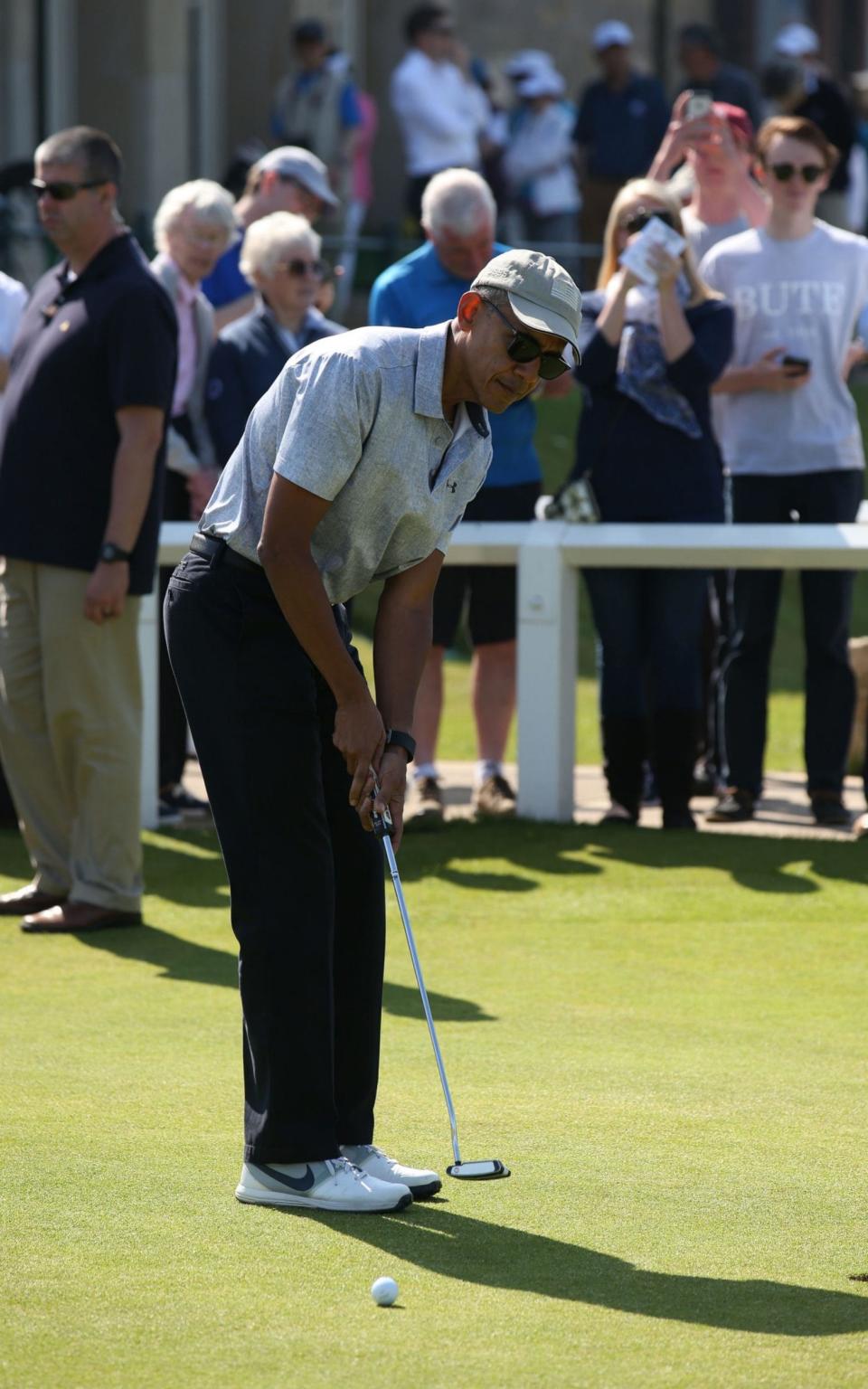Barack Obama on the putting green  - Credit: Andrew Milligan/PA