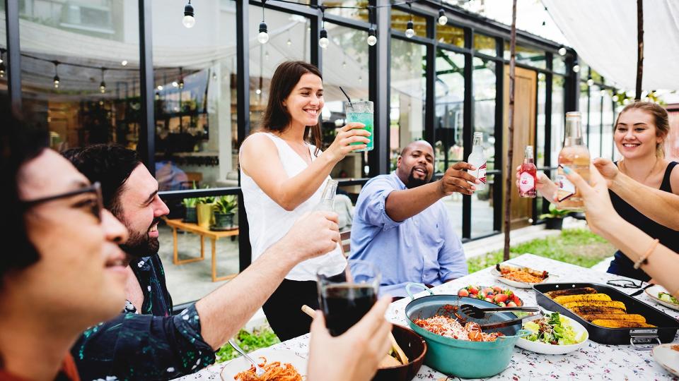 Group of diverse friends enjoying summer party together.