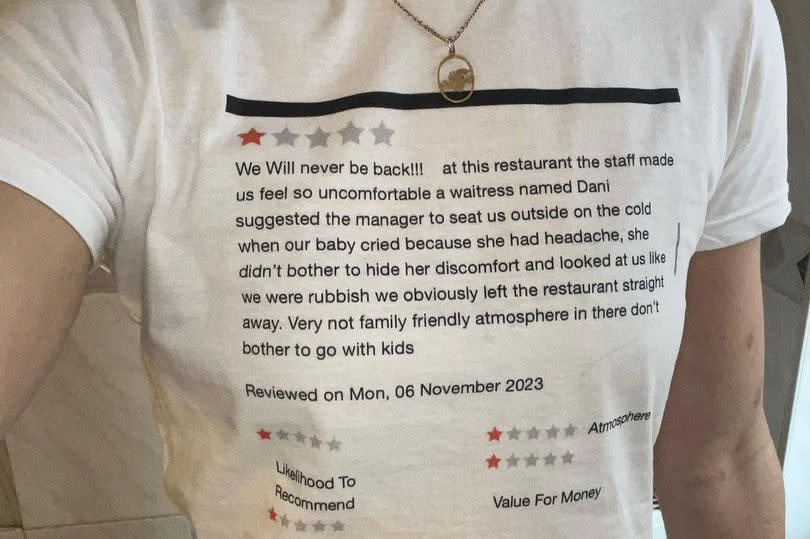 A personalised white t-shirt with a one-star review on it