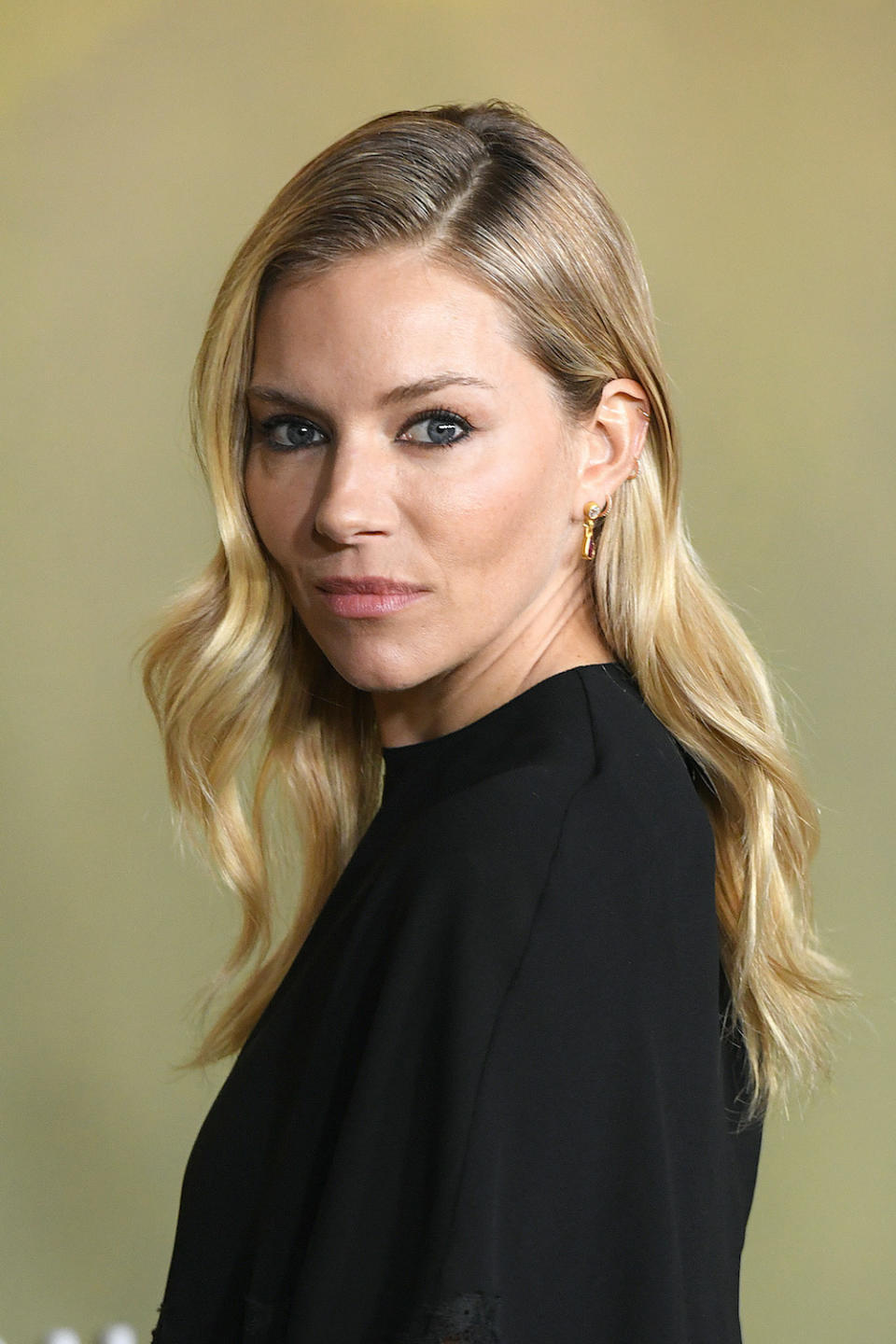 <p> Very loose beachy waves like actress Sienna Miller's look here are a modern variation of a popular 50s hairstyle, while still retaining that vintage vibe. Using one of the best curling irons or wands, you can easily copy this hairstyle at home. </p>