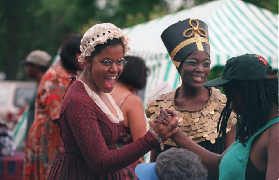 Two girls dressed up as Phyllis Wheatley and Nefertiti at Theodore Wirth Park in Minneapolis.