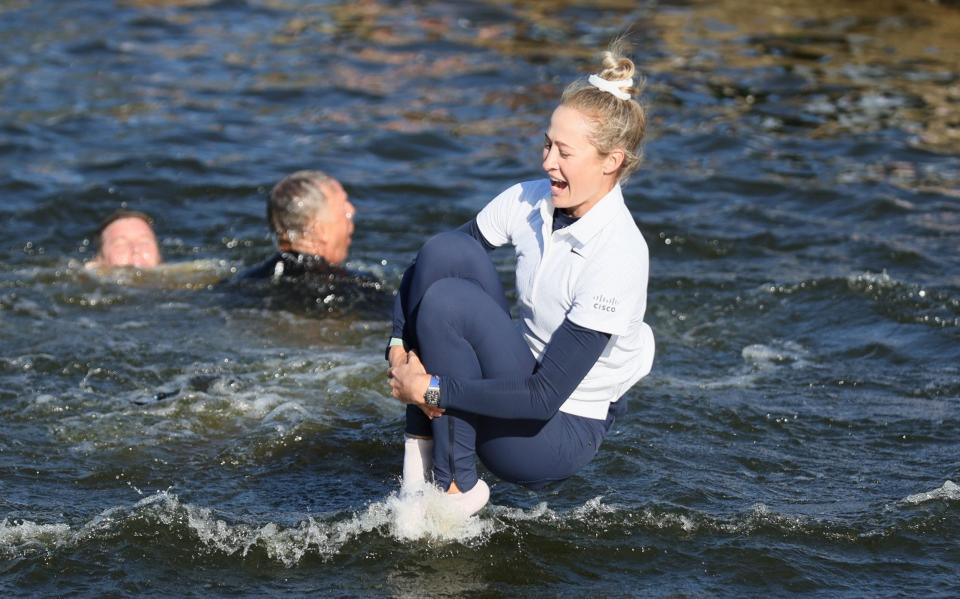 Nelly Korda of the United States jumps into the water after winning The Chevron Championship at The Club at Carlton Woods on April 21, 2024 in The Woodlands, Texas