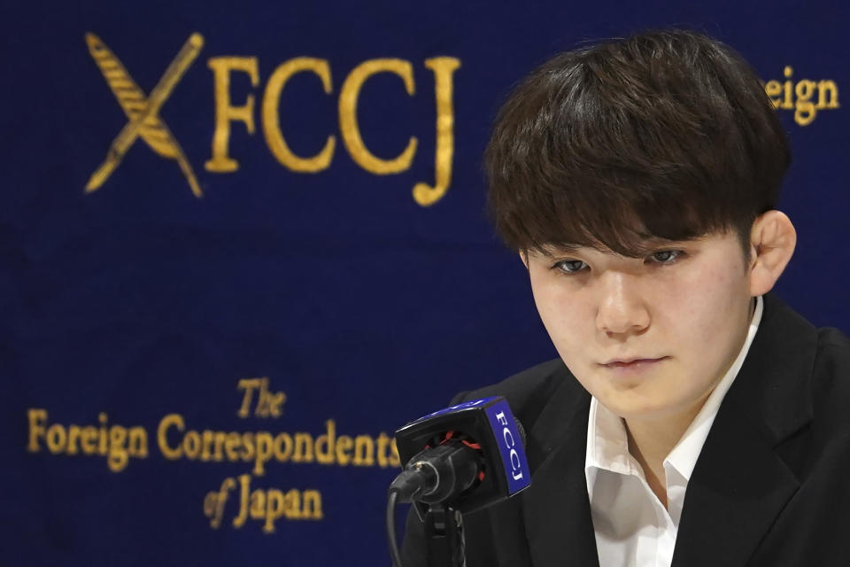 Rina Gonoi, former member of the Japan Ground Self-Defense Forces, listens questions during the press conference at the Foreign Correspondents' Club of Japan, Monday, Dec. 19, 2022, in Tokyo. Gonoi filed a sexual harassment case with the Defense Ministry last year, saying she had suffered multiple assaults by a number of male colleagues, causing her to give up her military career. (AP Photo/Eugene Hoshiko)