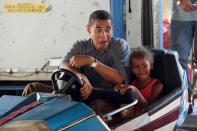 Democratic Presidential Candidate Senator Barack Obama (D-IL) drives a bumper car with his daughter Sasha at the Iowa State Fair August 16, 2007 in Des Moines, Iowa. (Photo by Scott Olson/Getty Images)