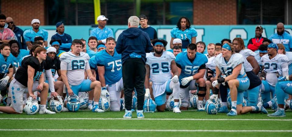 North Carolina coach Mack Brown talks with his team following their open practice on Saturday, March 25, 2023 at Kenan Stadium in Chapel Hill. N.C.