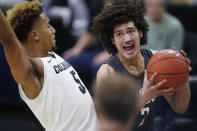 Washington State forward CJ Elleby, right, drives to the rim as Colorado guard D'Shawn Schwartz defends in the first half of an NCAA college basketball game Thursday, Jan. 23, 2020, in Boulder, Colo. (AP Photo/David Zalubowski)