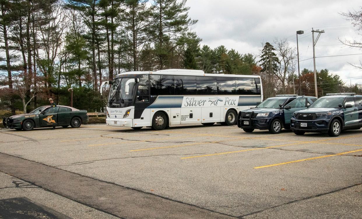 A bus carrying jurors and other court officials from the murder trial of Julia Enright visits sites referenced during testimony Monday,  including the far corner of a Hannaford supermarket parking lot on Route 202. The murder victim Brandon Chicklis' vehicle was found at this location.