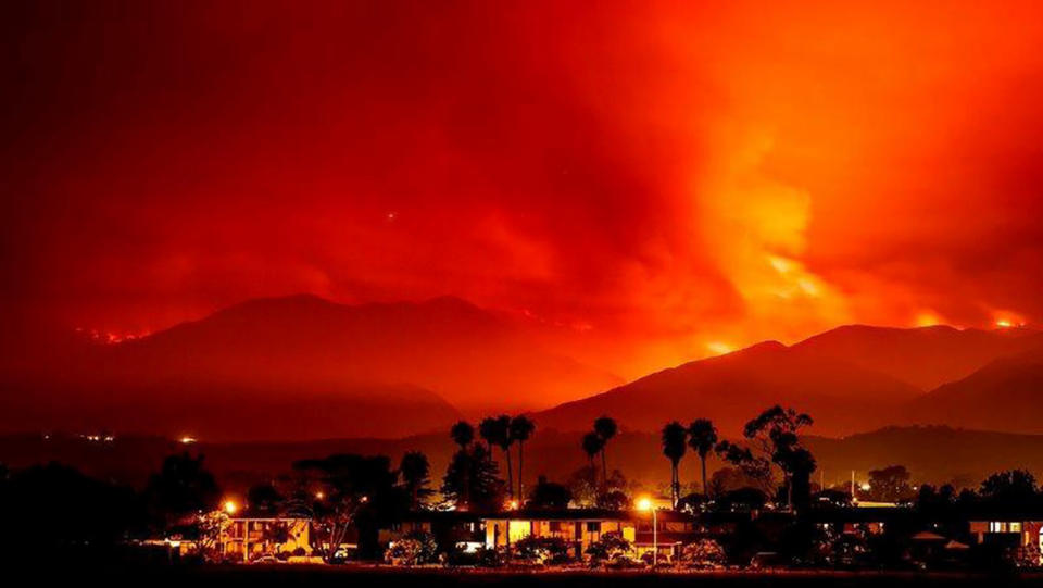 Smoke is illuminated by the Whittier wildfire near Santa Ynez