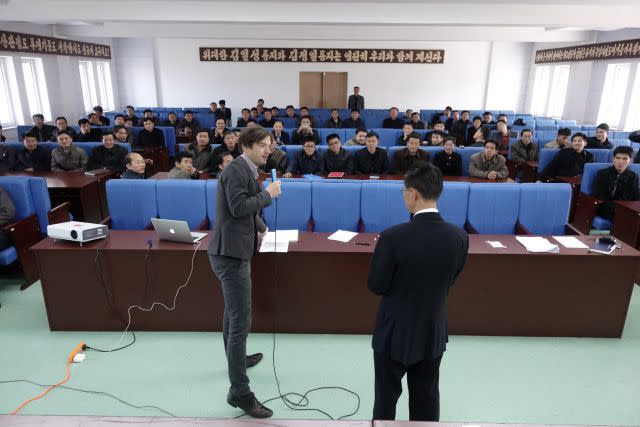 A foreign seminar leader leads a business class in the DPRK.