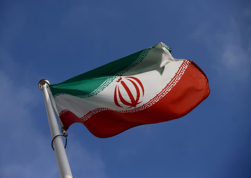 FILE PHOTO: The Iranian flag waves in front of the International Atomic Energy Agency (IAEA) headquarters in Vienna